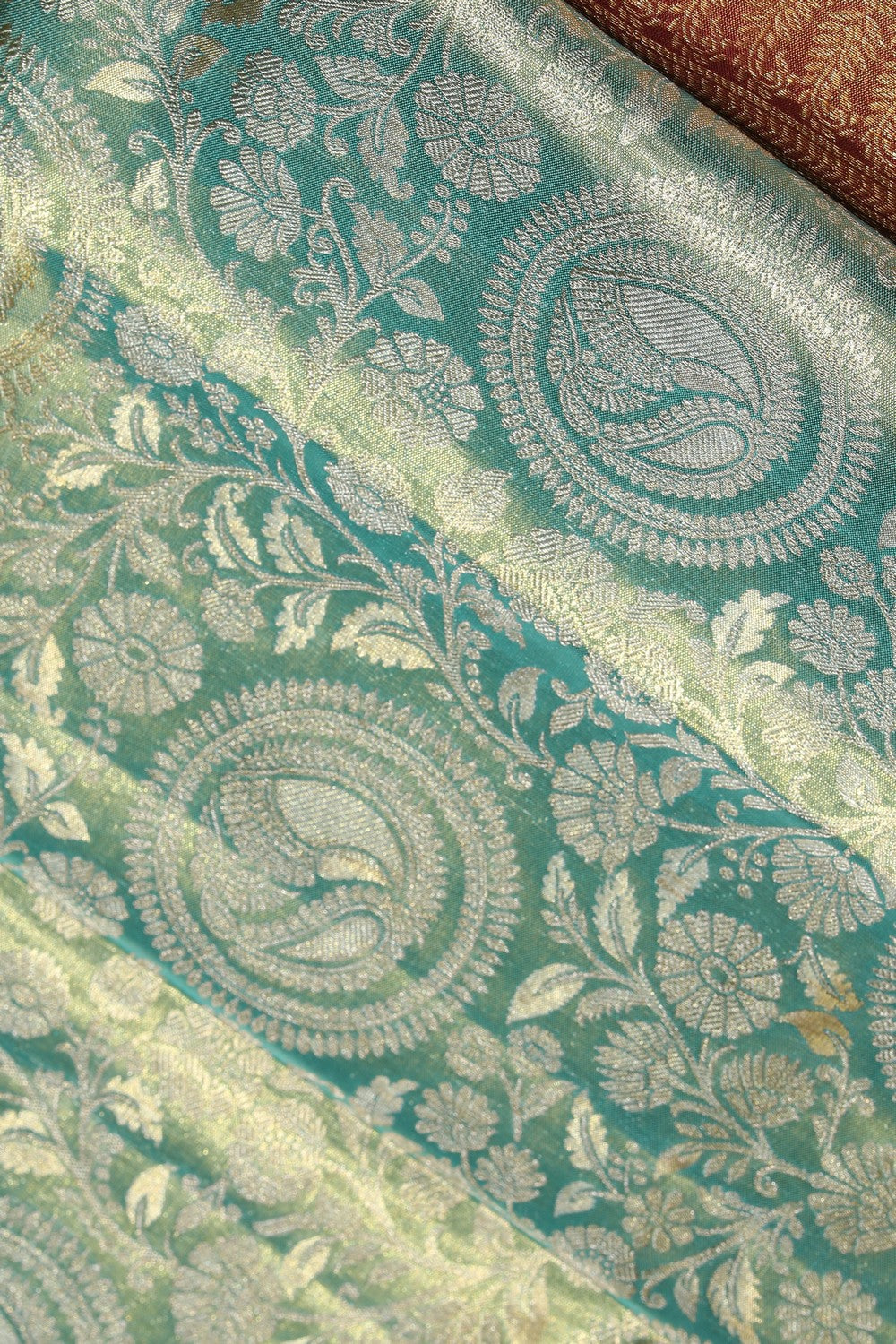 Collection of Kanchipattu Tissue Brocade Green Saree in a gallery layout