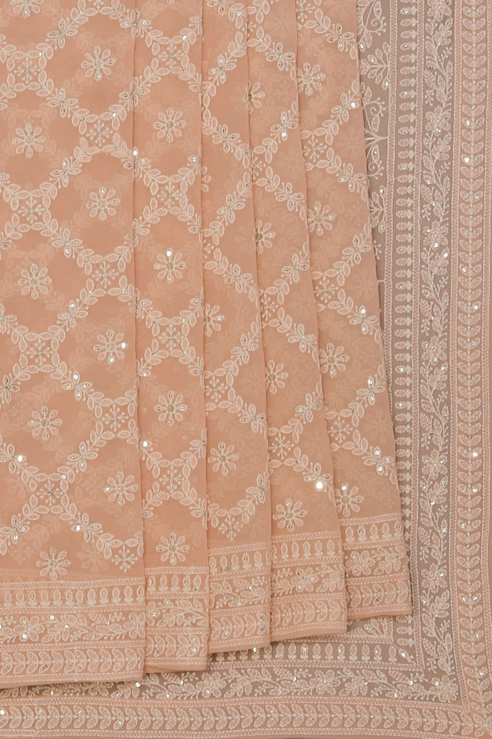 Collection of Georgette Pastel-Peach Saree in a gallery layout