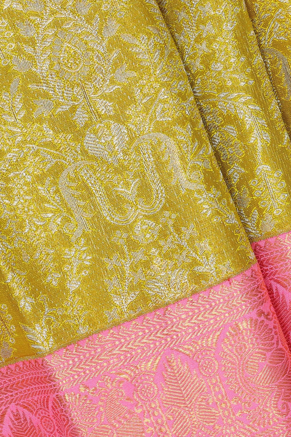 Collection of Kanchipattu Parrot Green Tissue Brocade Saree in a gallery layout