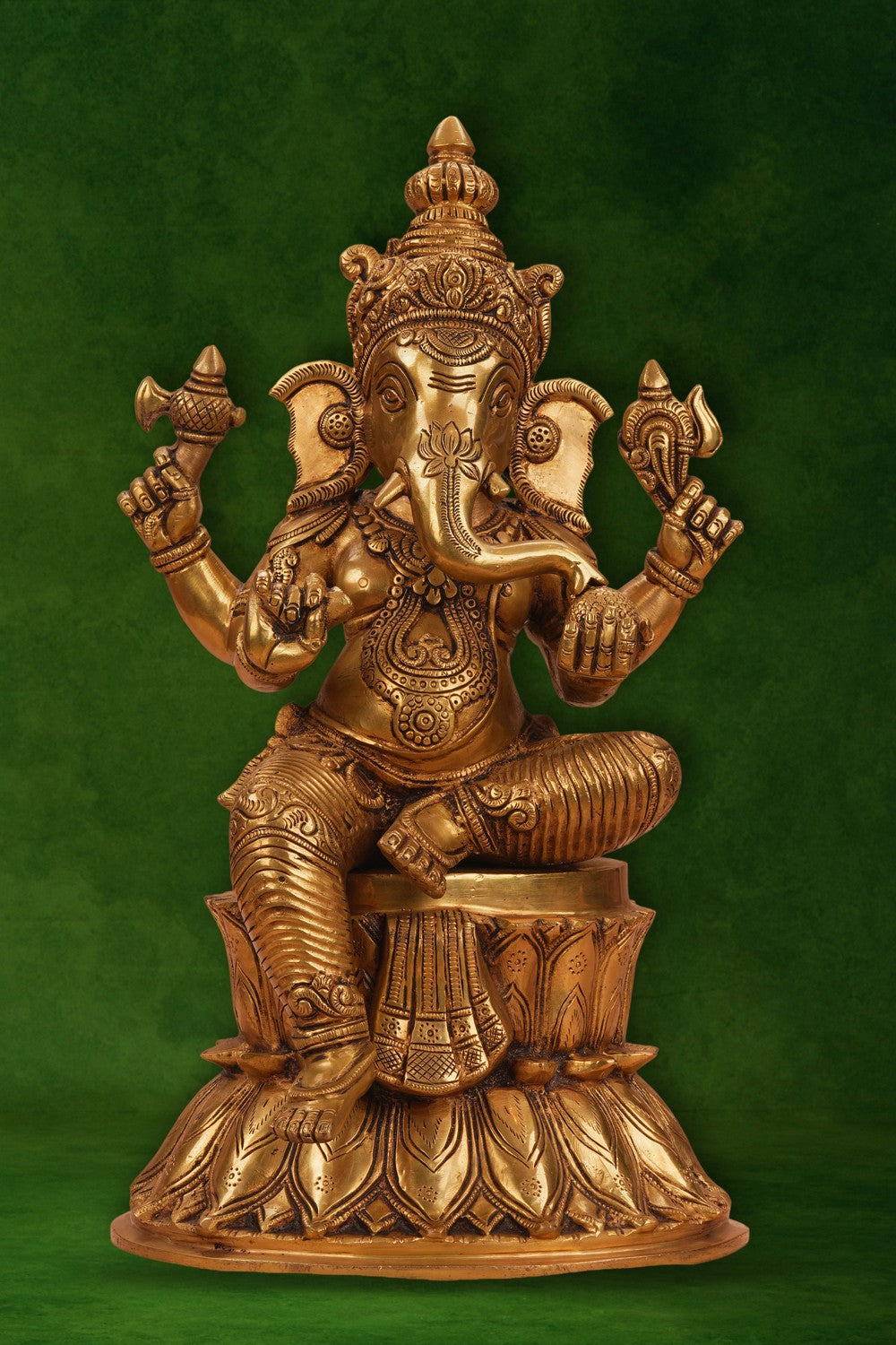 Image of A brass Ganesha seated on a lotus