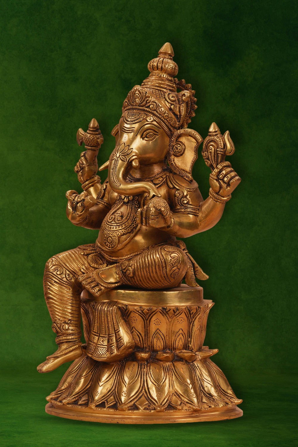 Image of A brass Ganesha seated on a lotus