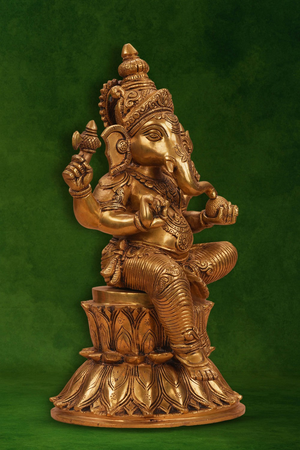 Image of A brass Ganesha seated on a lotus
