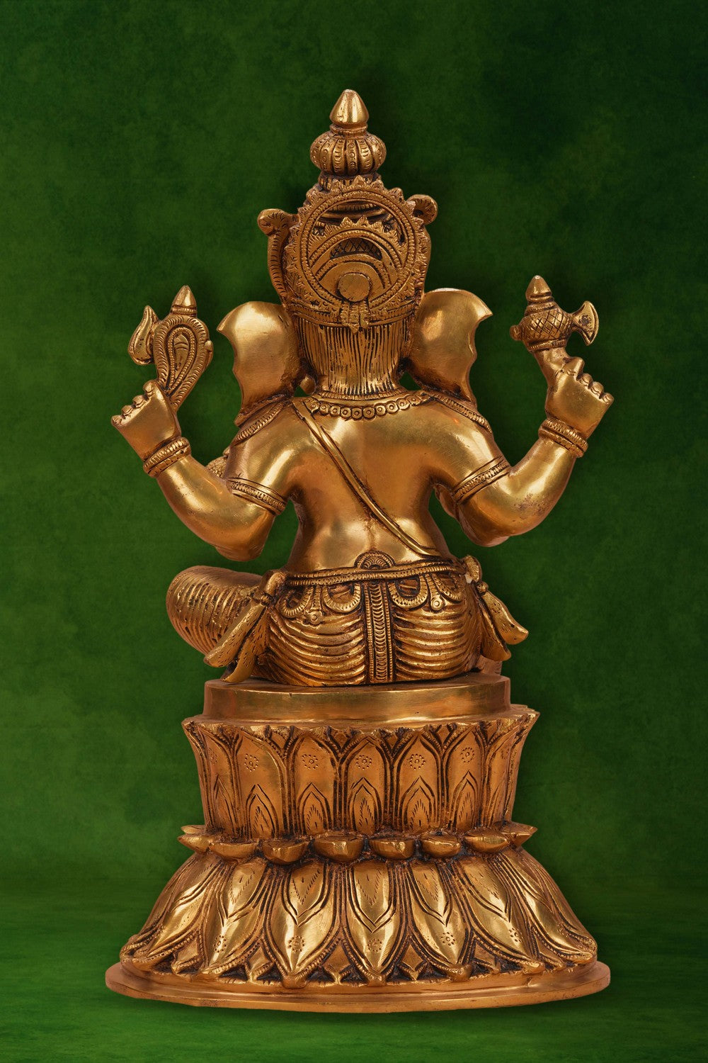 Image of A brass Ganesha seated on a lotus