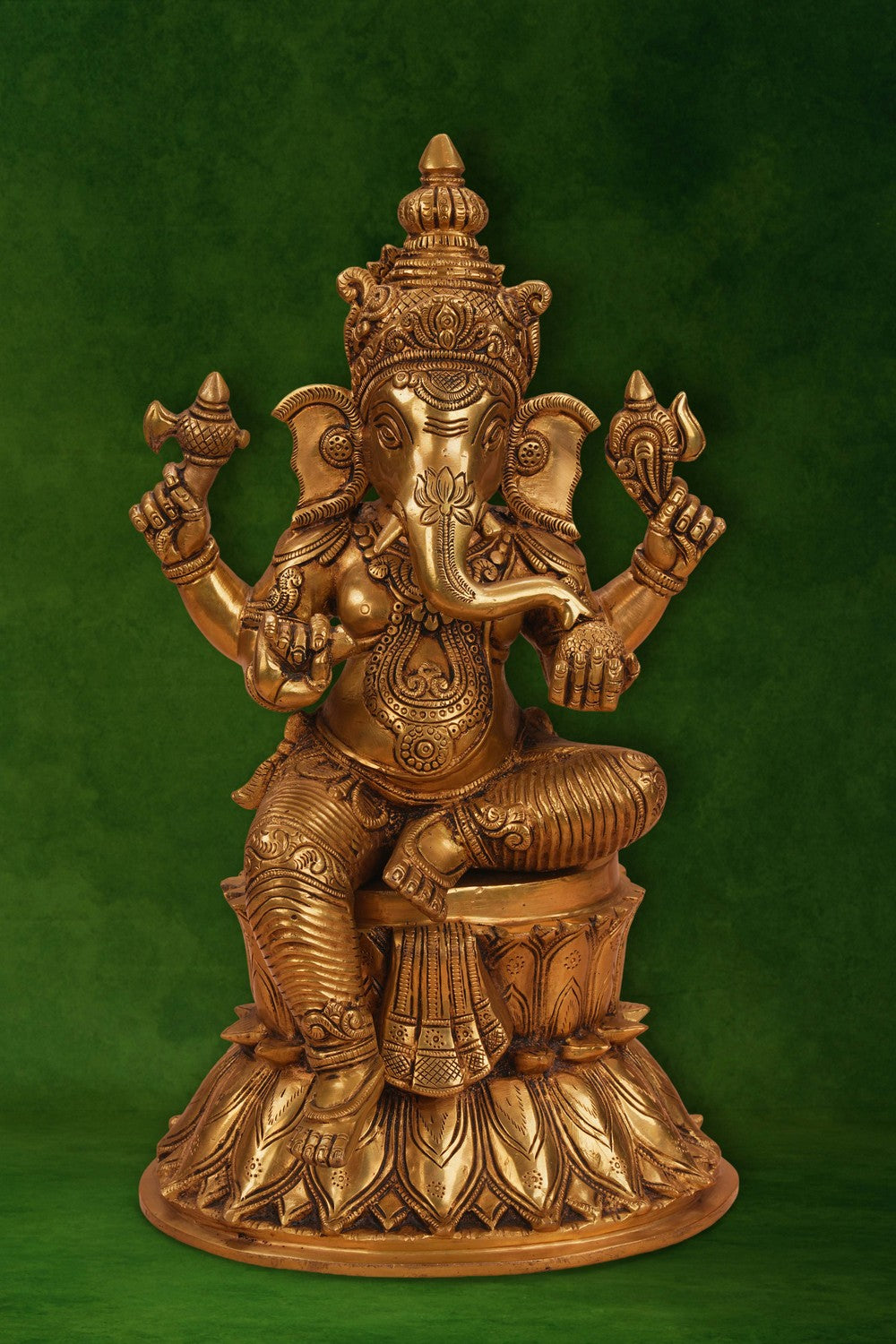 Image of A brass Ganesha seated on a lotus
