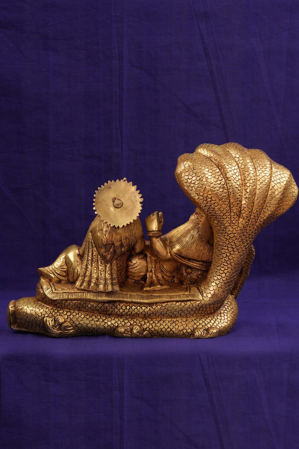 Brass Lord Vishnu and Goddess Lakshmi reclining on the serpent Sesha Naga.