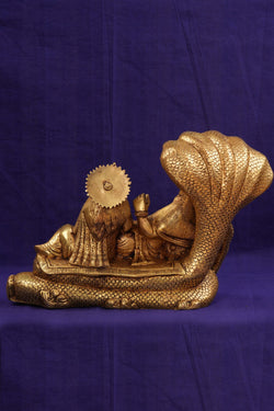 Image of Brass Lord Vishnu and Goddess Lakshmi reclining on the serpent Sesha Naga.