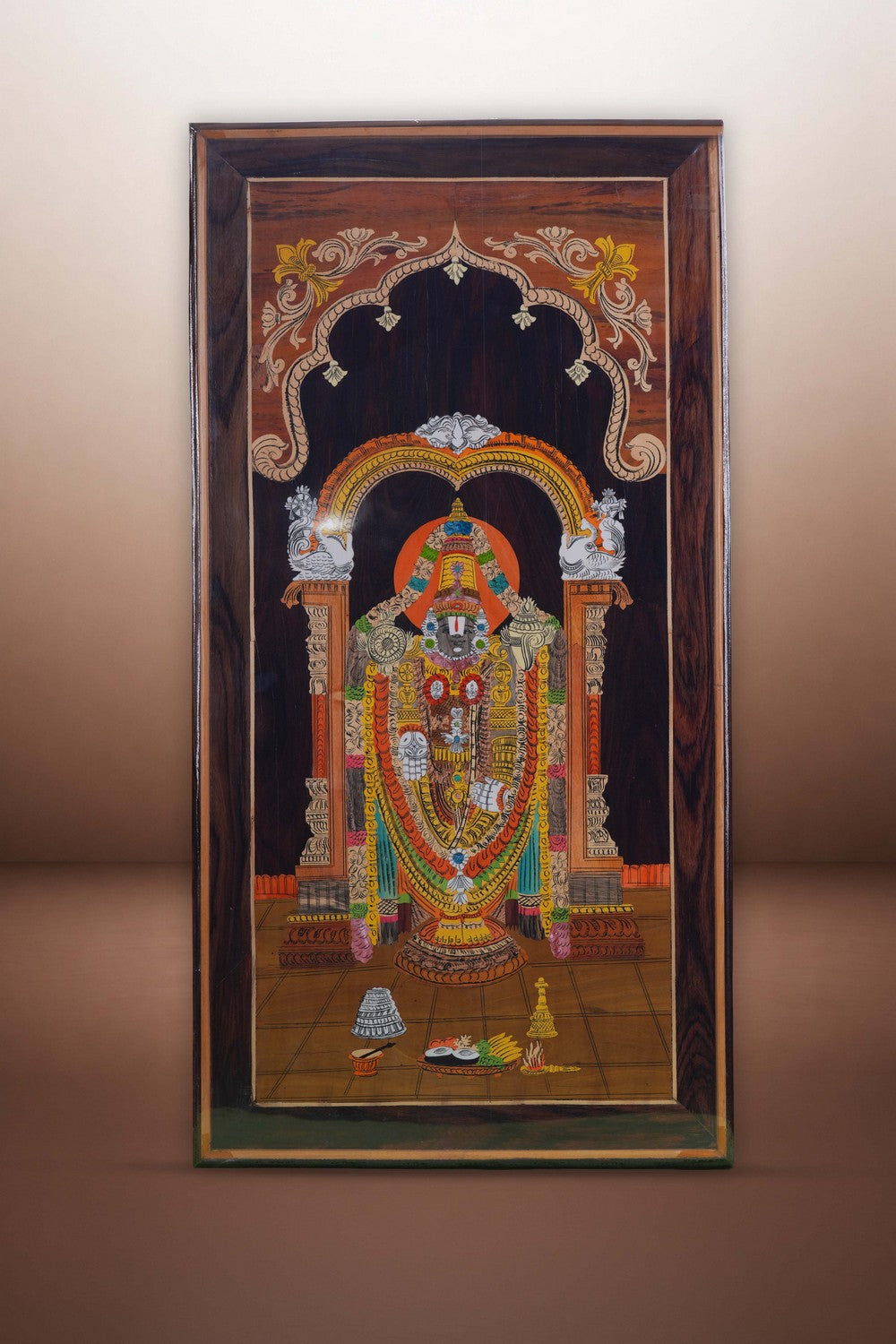 Image of Tirupati Balaji with panel in rosewood with inlay work