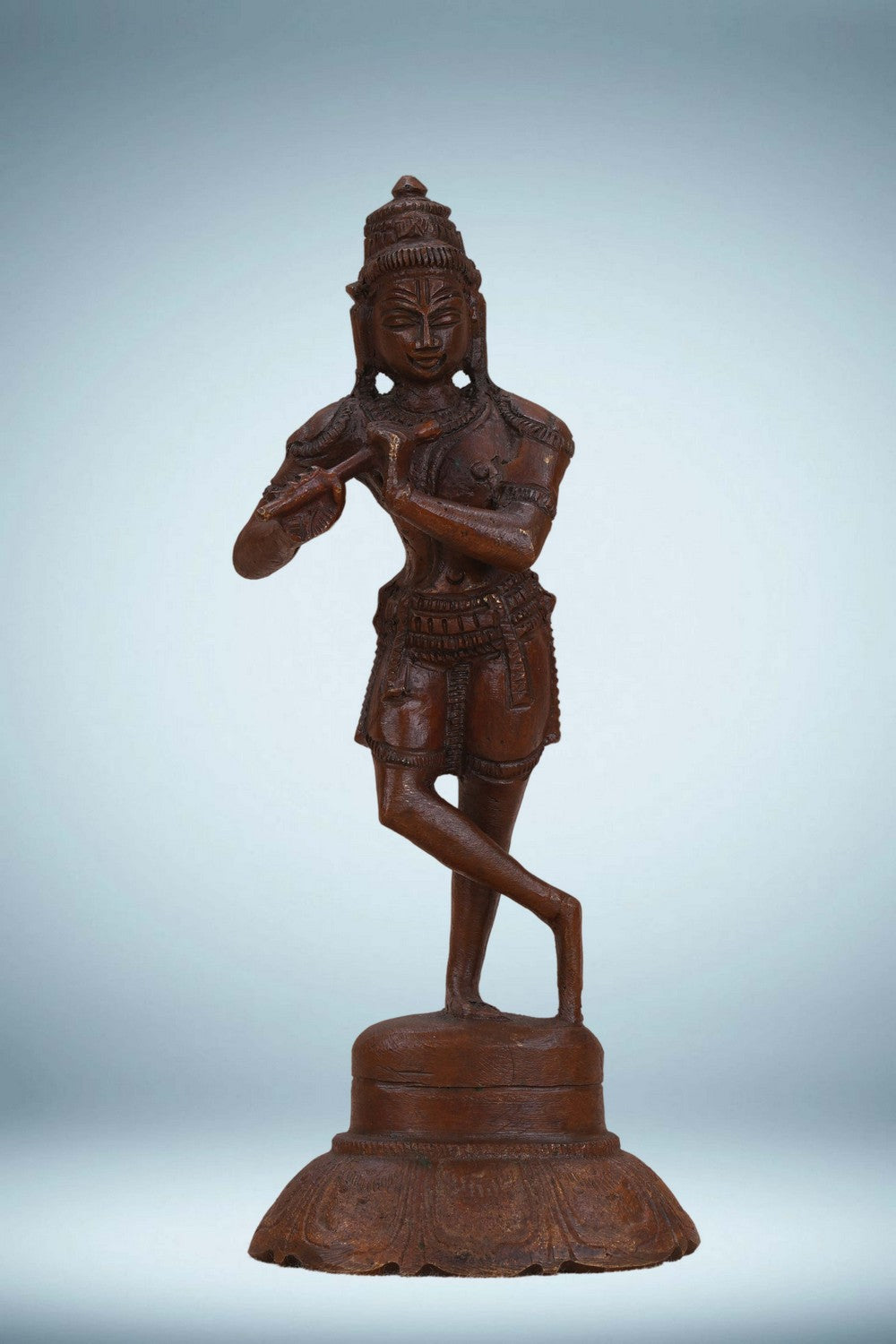 Image of Bronze Krishna playing the flute in a standing