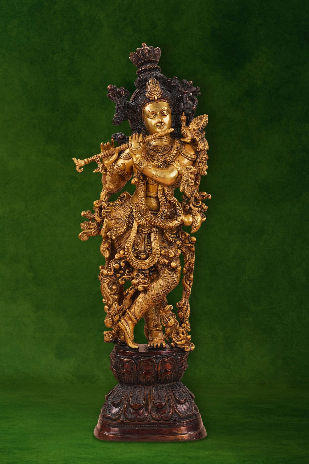 Image of A brass Krishna statue depicting the deity playing the flute