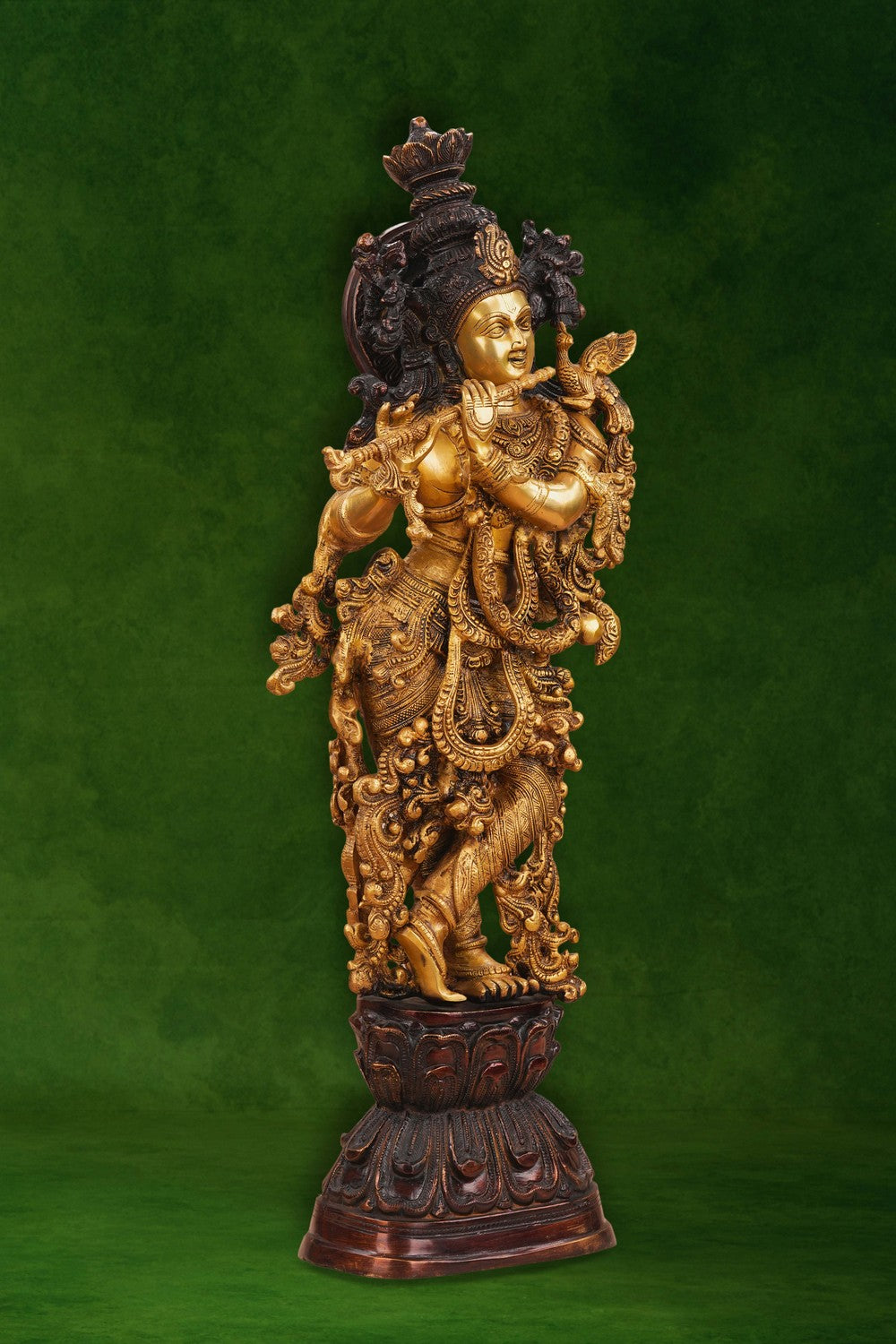 Image of A brass Krishna statue depicting the deity playing the flute