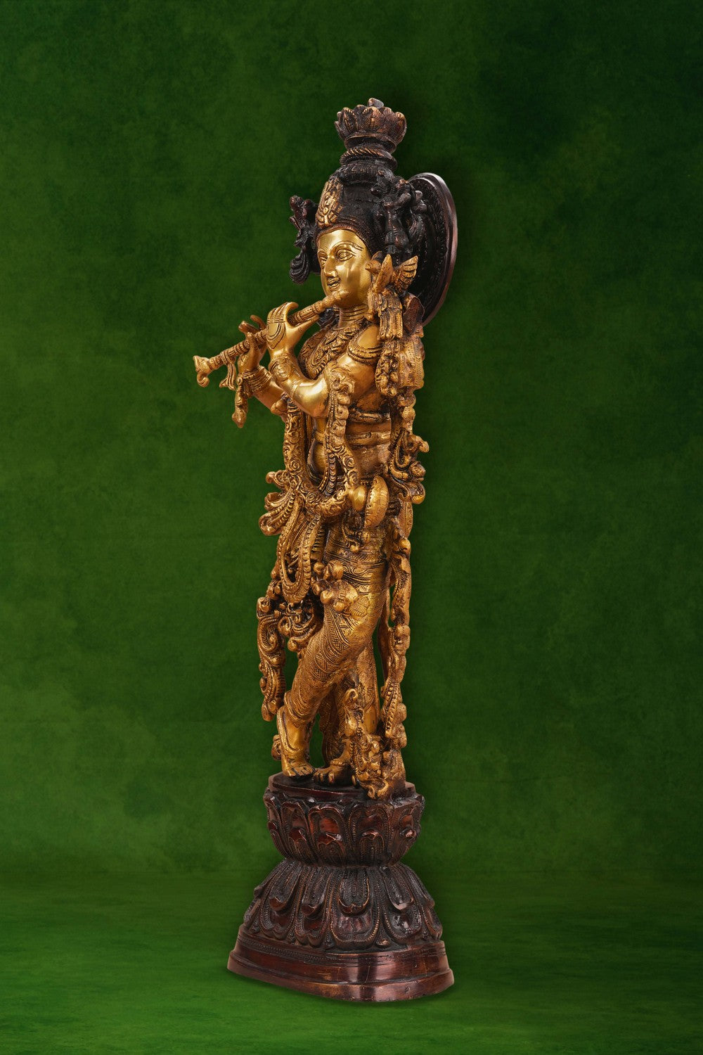 Image of A brass Krishna statue depicting the deity playing the flute
