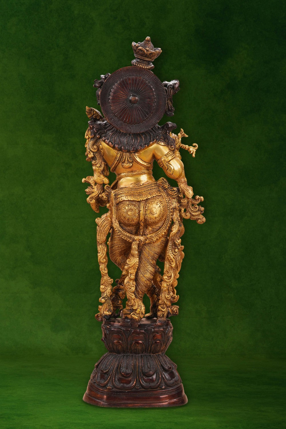 Image of A brass Krishna statue depicting the deity playing the flute