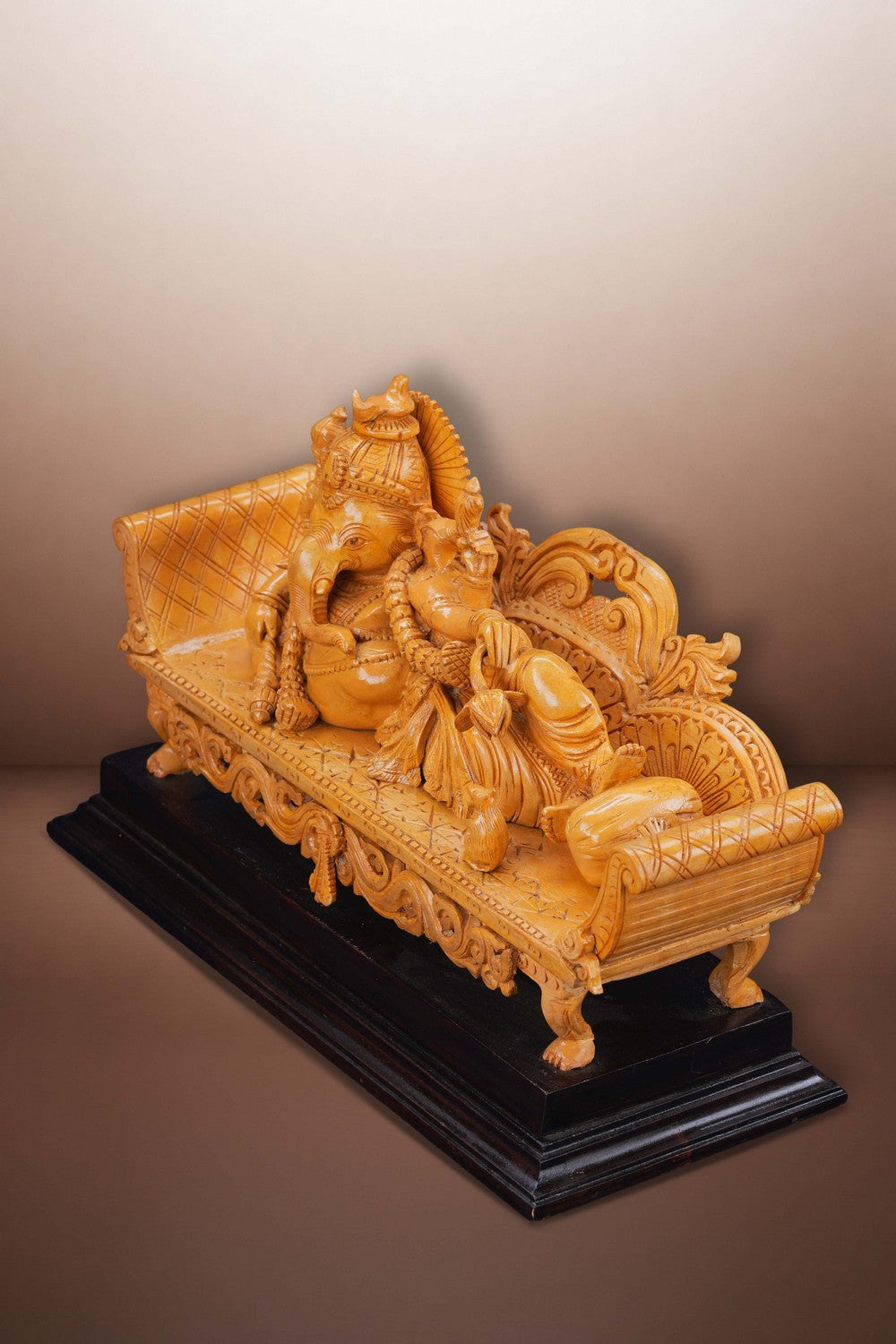 Image of Resting Ganesha Wooden Sculpture