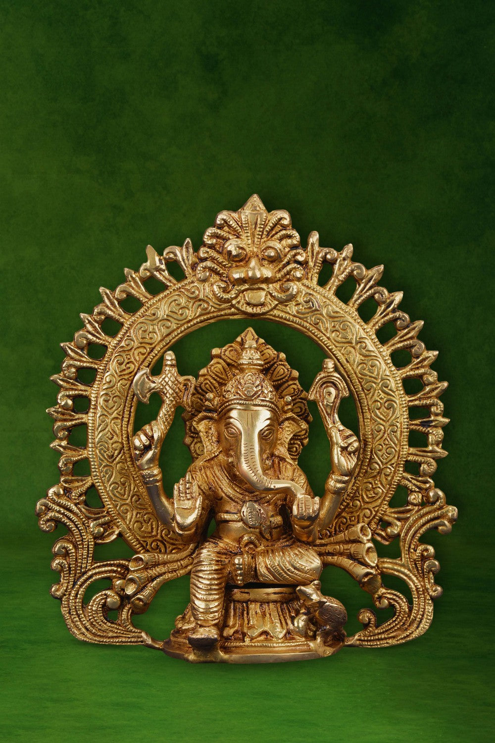 Image of A brass Ganesha idol in a sitting posture