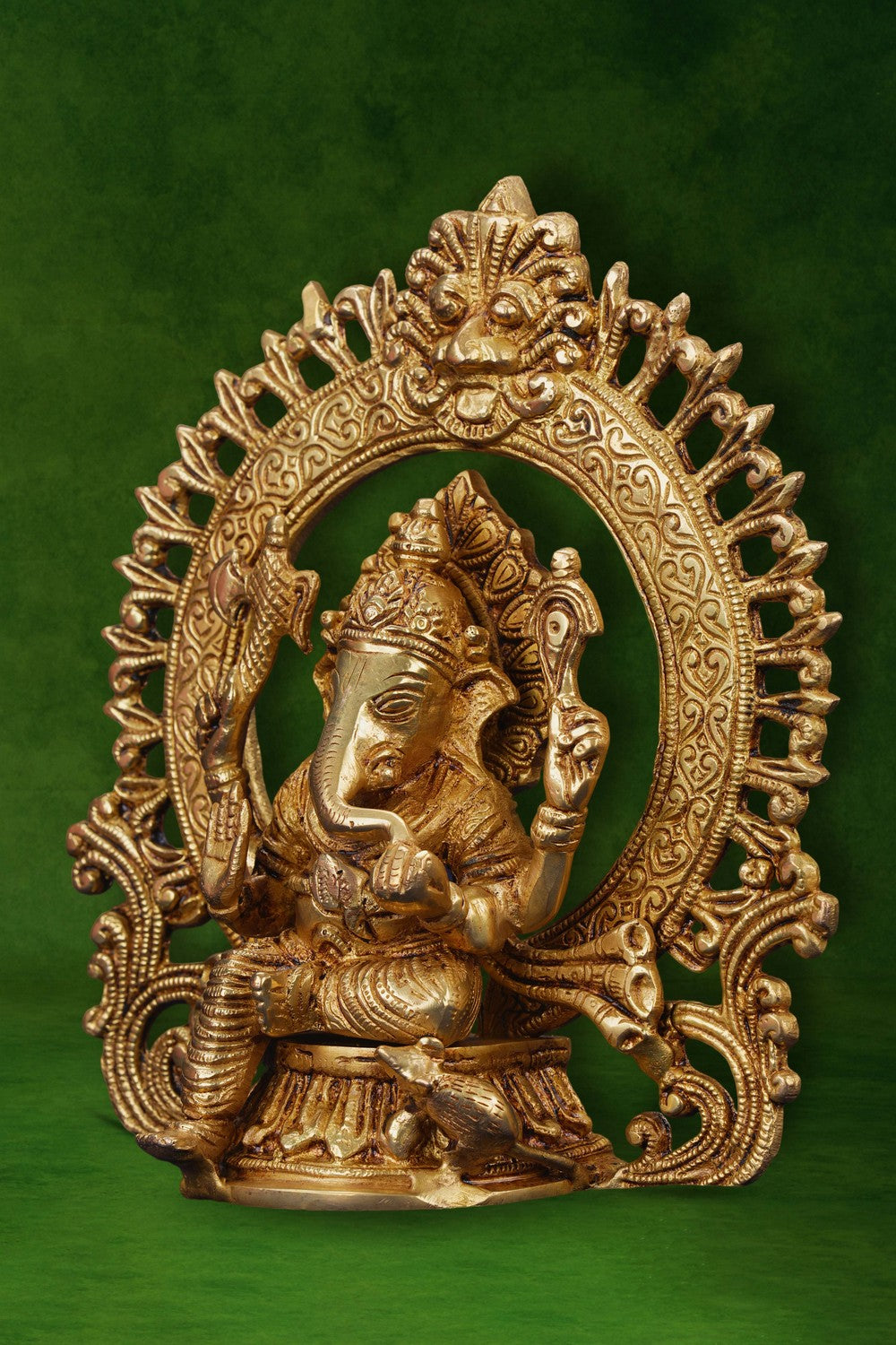 Image of A brass Ganesha idol in a sitting posture