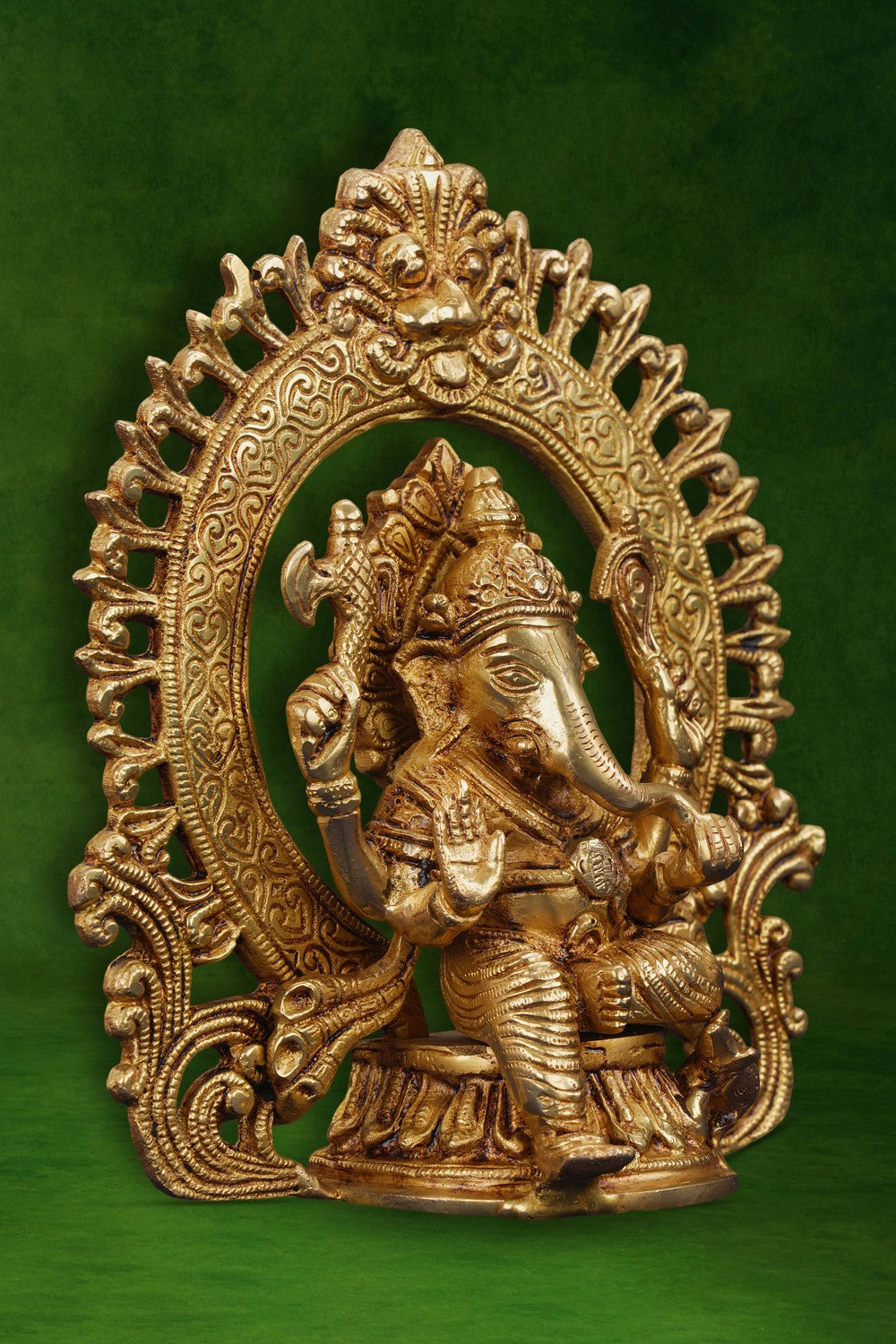 Image of A brass Ganesha idol in a sitting posture