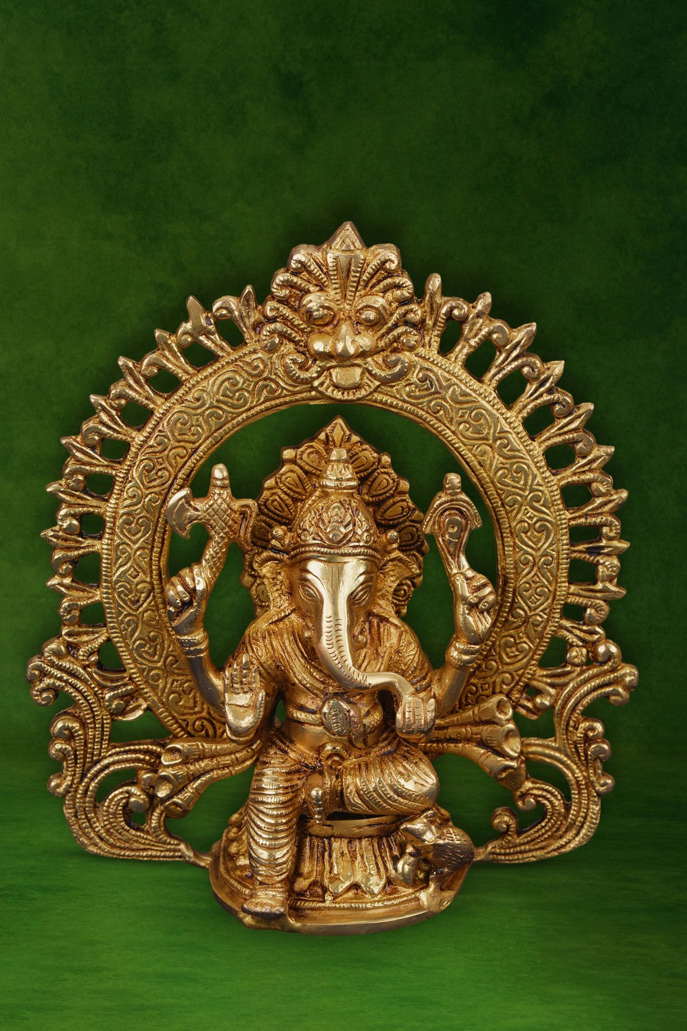 Image of A brass Ganesha idol in a sitting posture