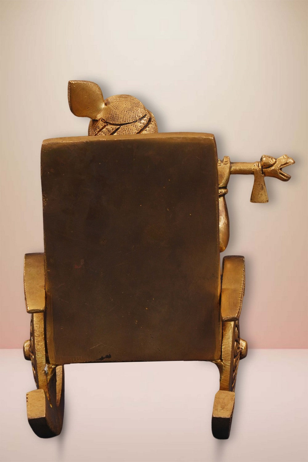Image of Brass Krishna Seated On A Rocking Chair