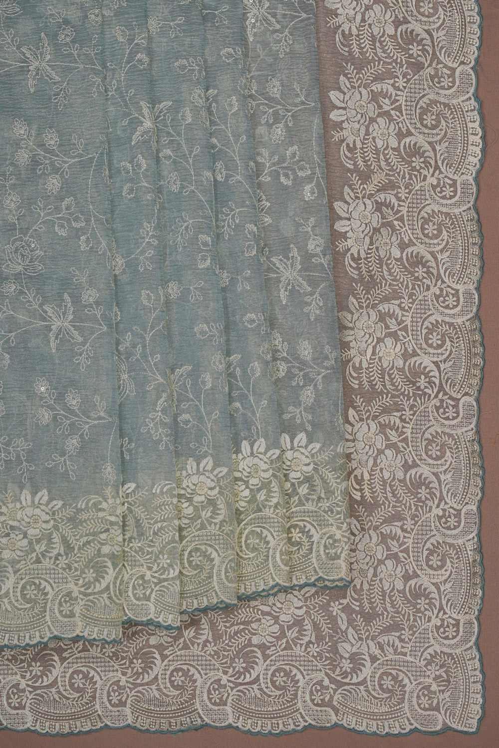 Image of Pastel Blue Shimmering Tissue Silk Saree