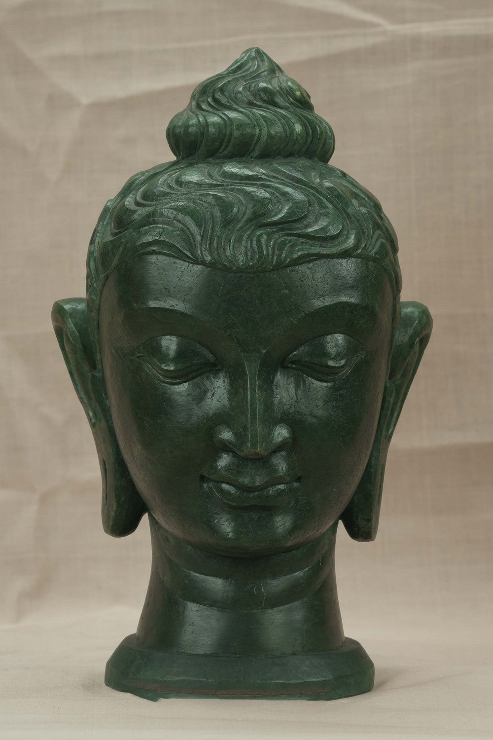 Image of A Green-painted Serpent Stone Buddha Face