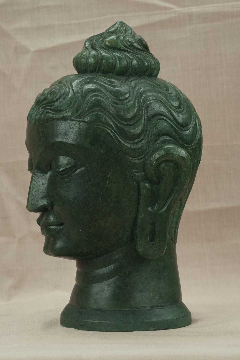 Image of A Green-painted Serpent Stone Buddha Face