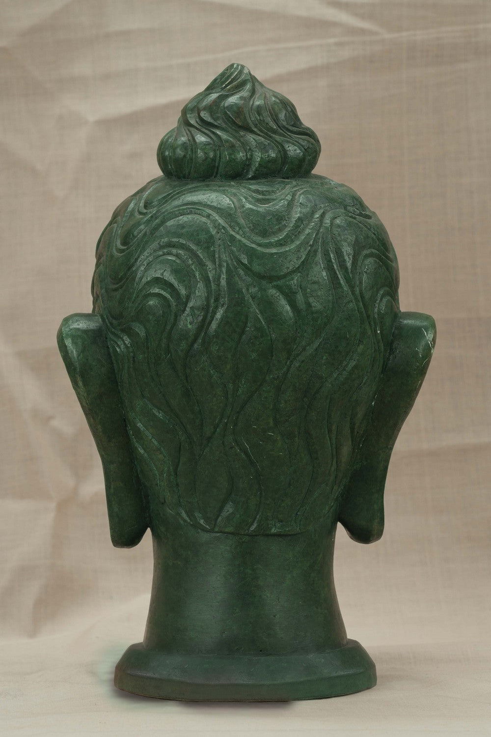 Image of A Green-painted Serpent Stone Buddha Face