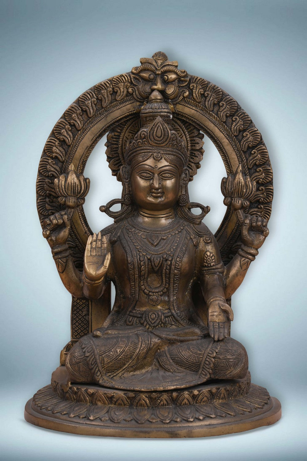 Image of Brass Maa Lakshmi with an antique finish seated on a lotus