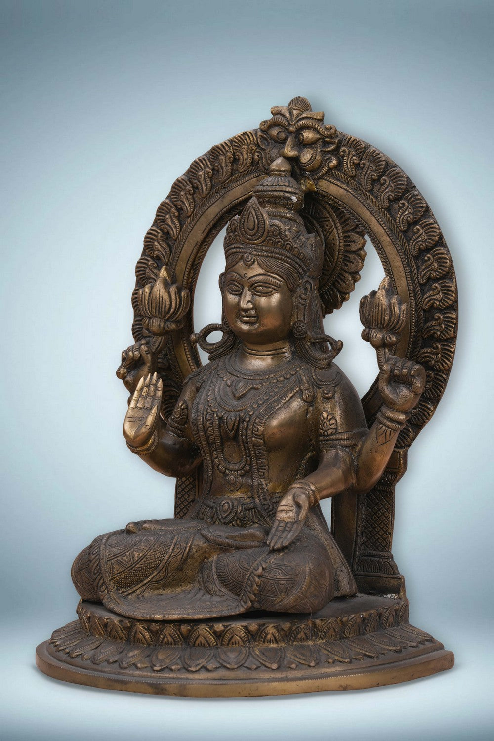 Image of Brass Maa Lakshmi with an antique finish seated on a lotus