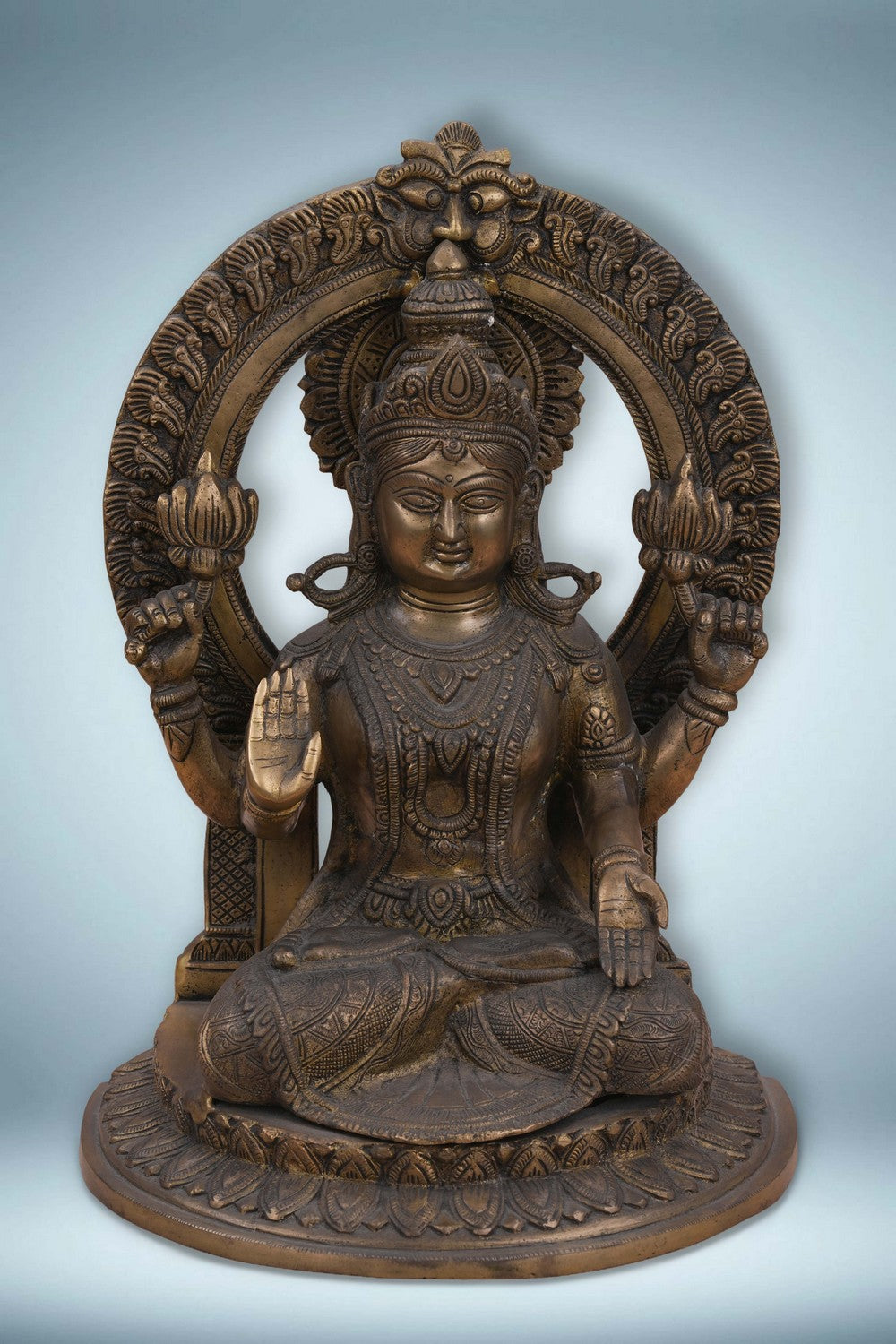 Image of Brass Maa Lakshmi with an antique finish seated on a lotus