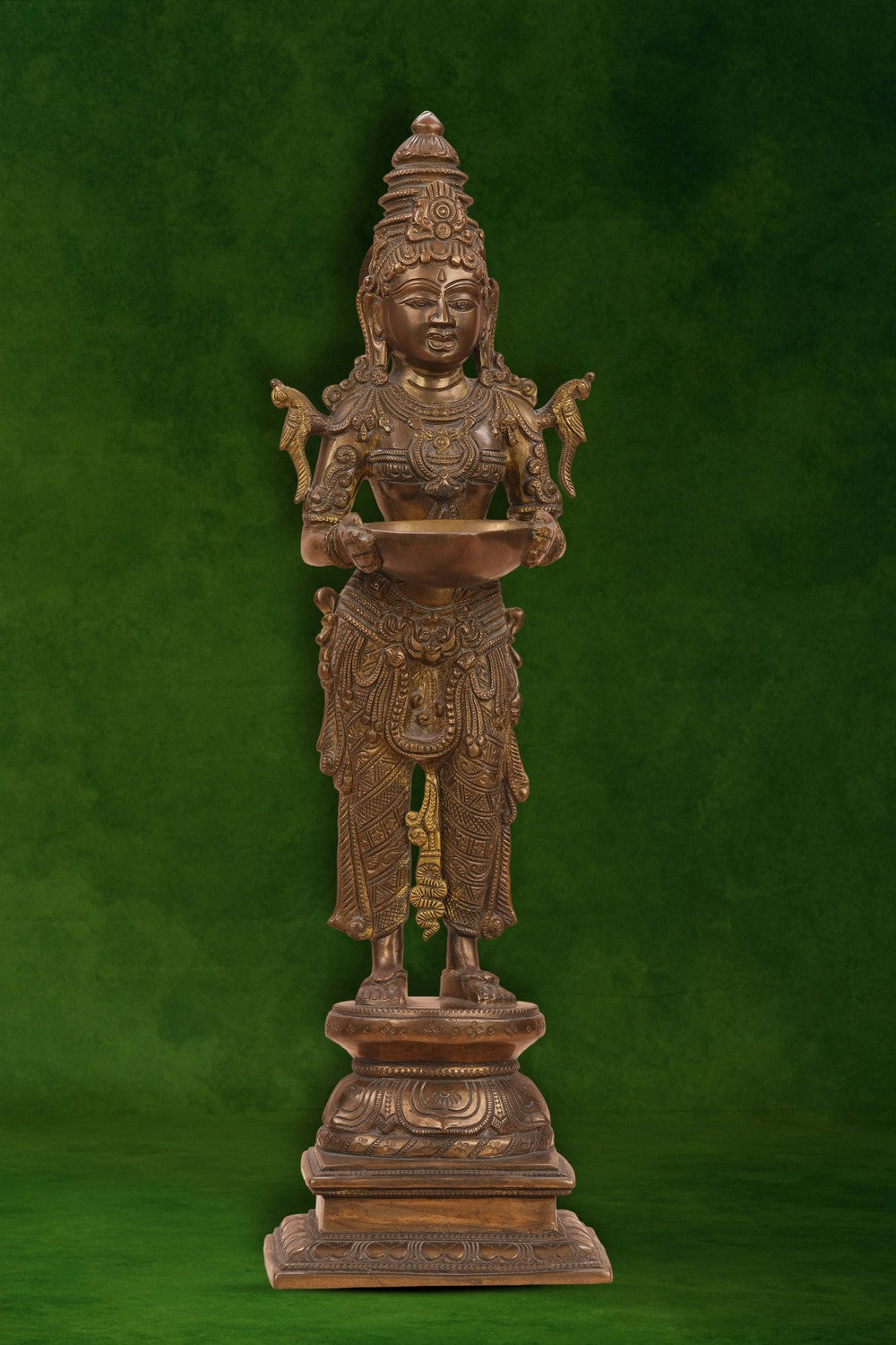 Image of Brass Woman in standing posture holding a diya