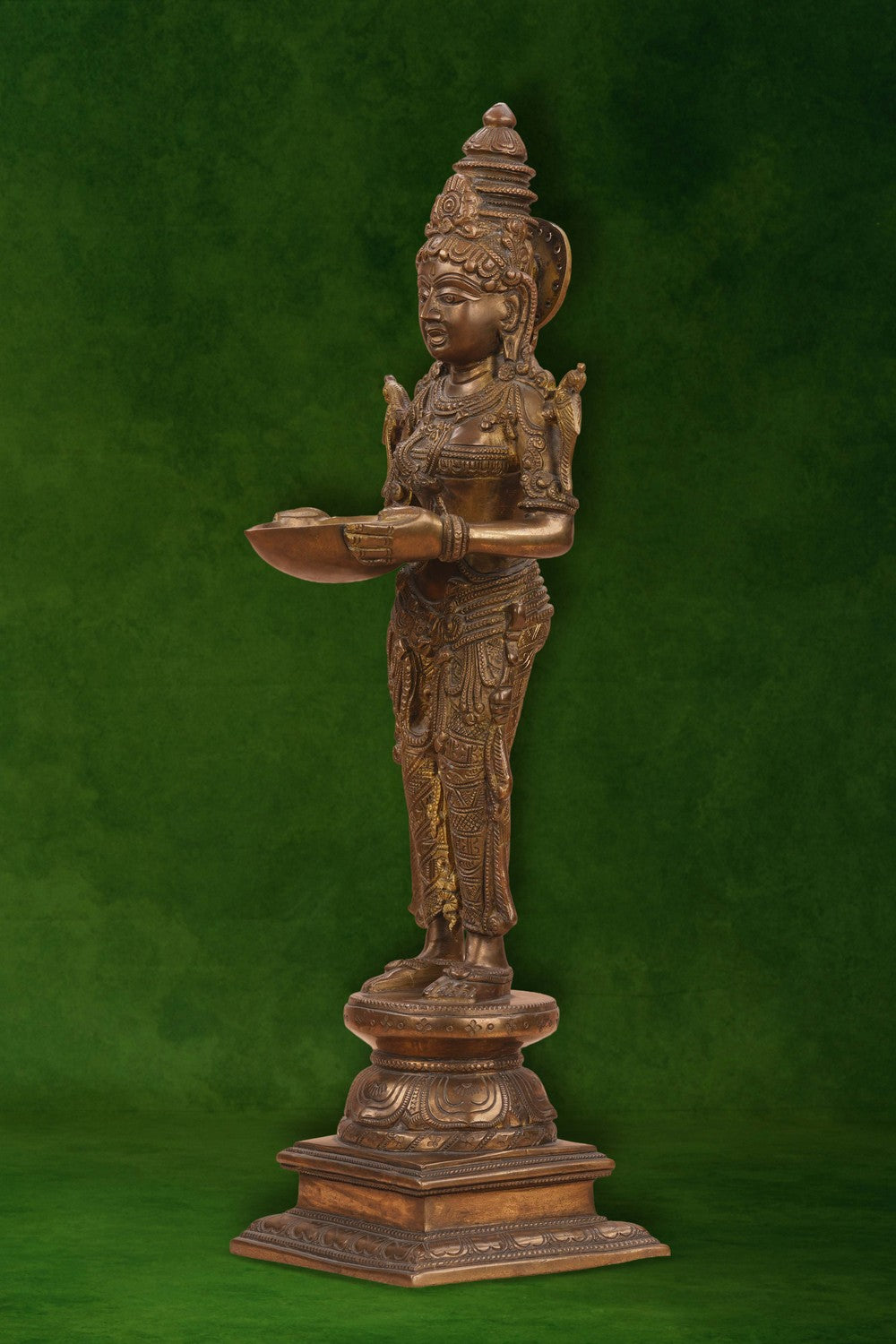 Image of Brass Woman in standing posture holding a diya
