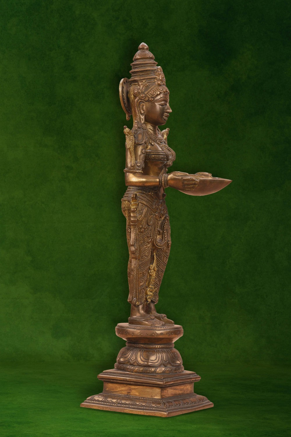 Image of Brass Woman in standing posture holding a diya