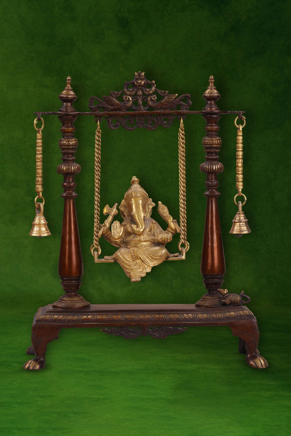 Image of Brass-Copper idol of Ganesha seated on an ornate swing