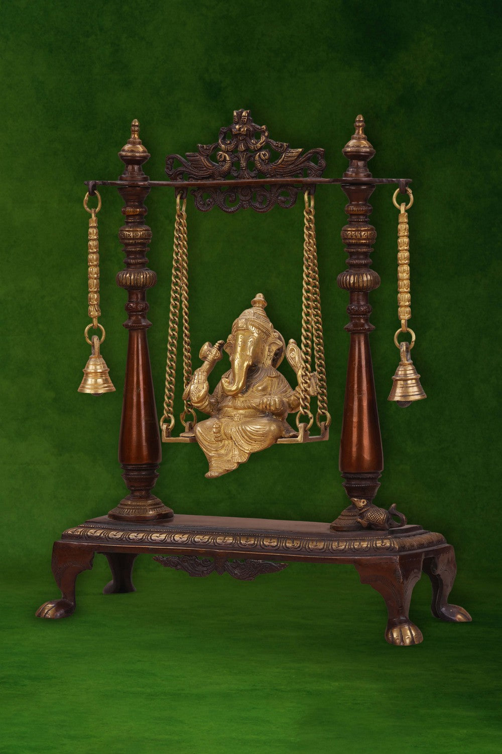 Image of Brass-Copper idol of Ganesha seated on an ornate swing