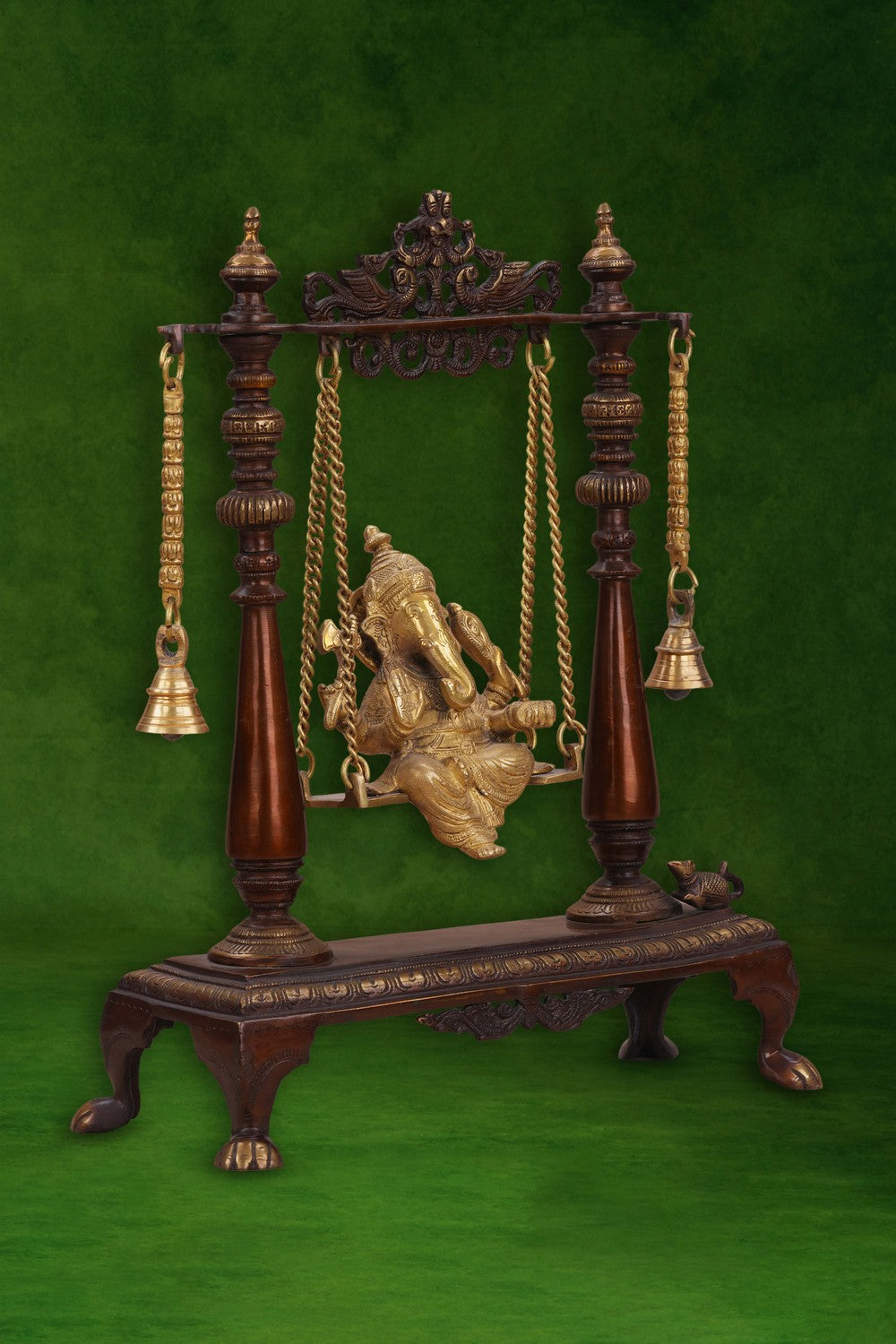 Image of Brass-Copper idol of Ganesha seated on an ornate swing