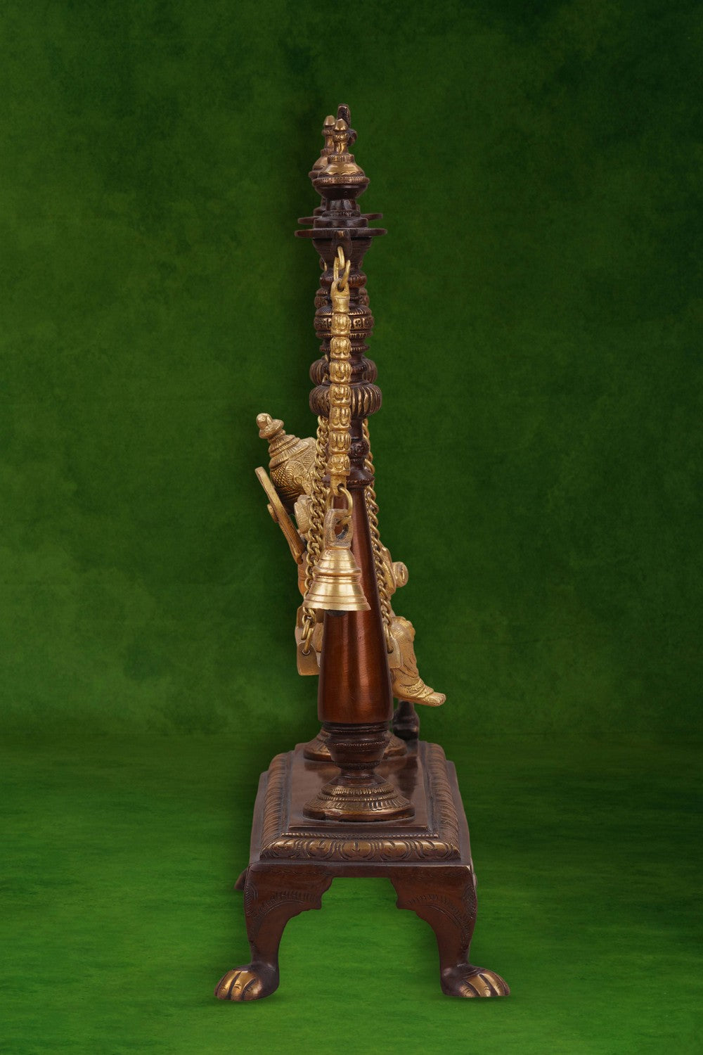 Image of Brass-Copper idol of Ganesha seated on an ornate swing