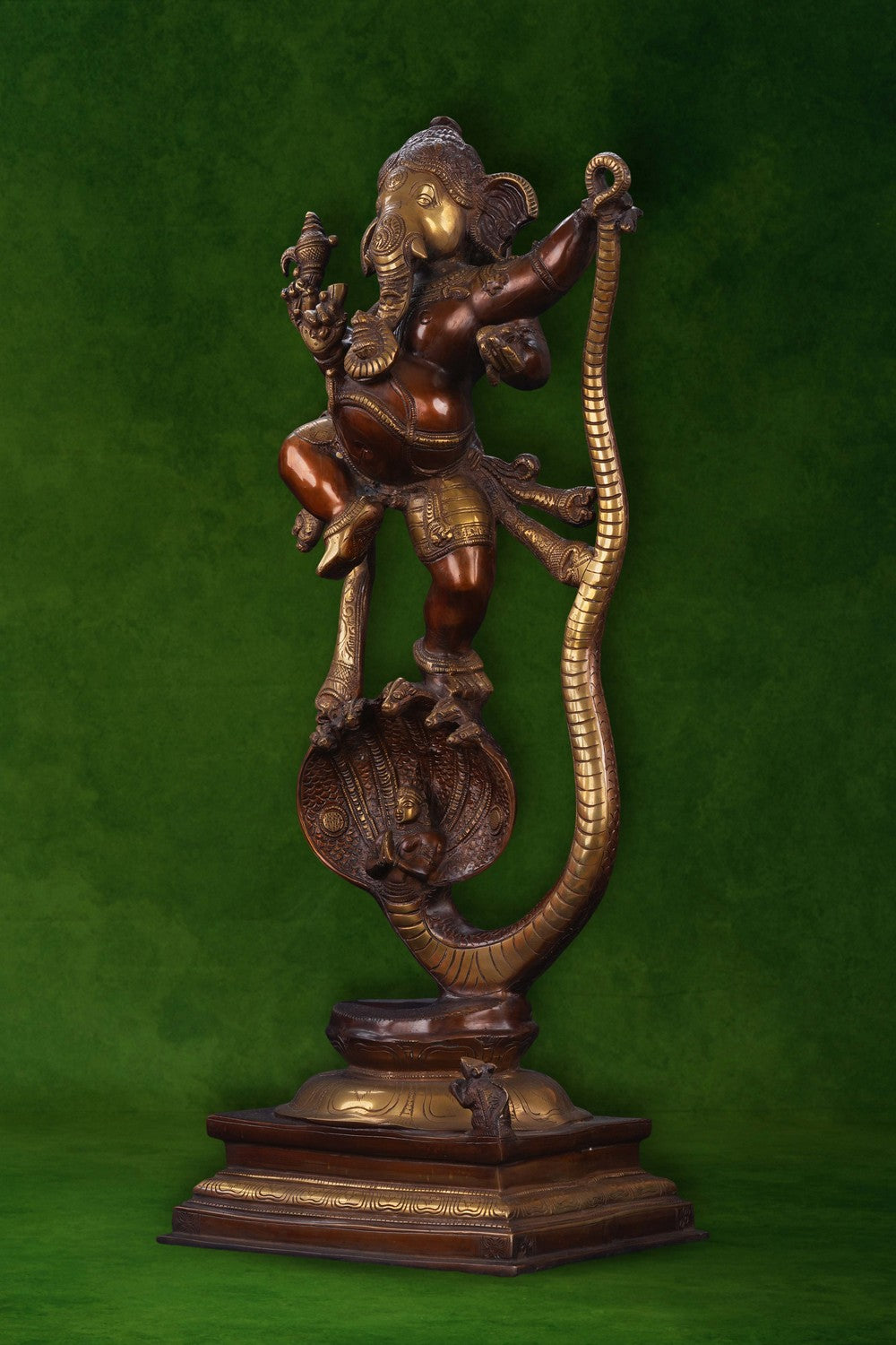 Image of Brass Ganesha idol dancing on a snake