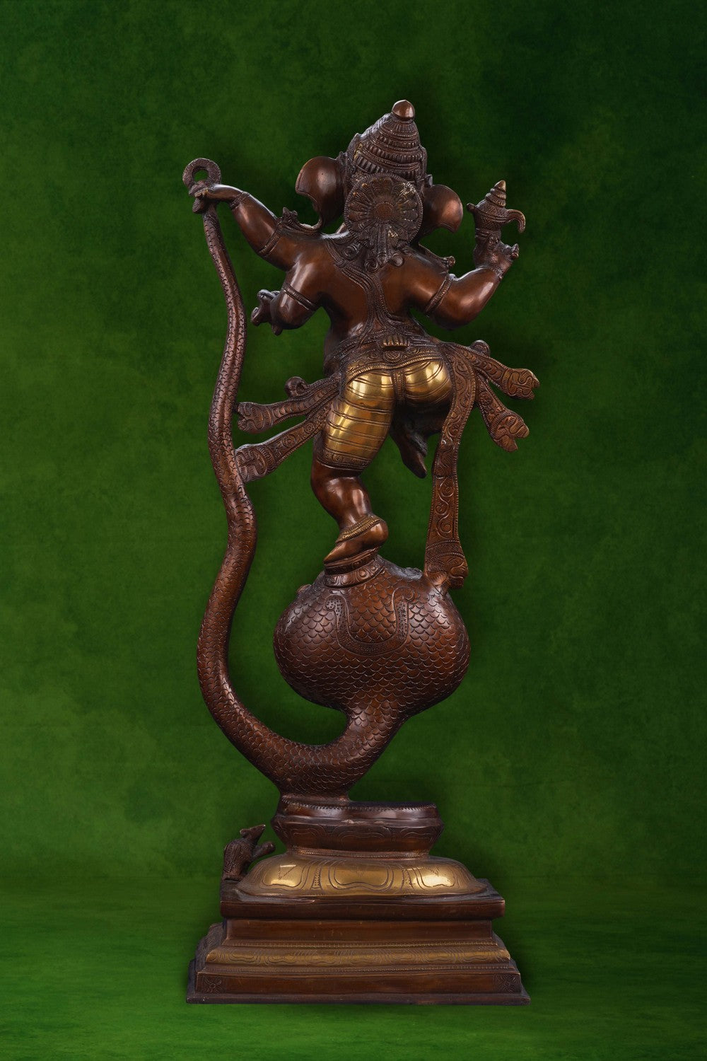 Image of Brass Ganesha idol dancing on a snake