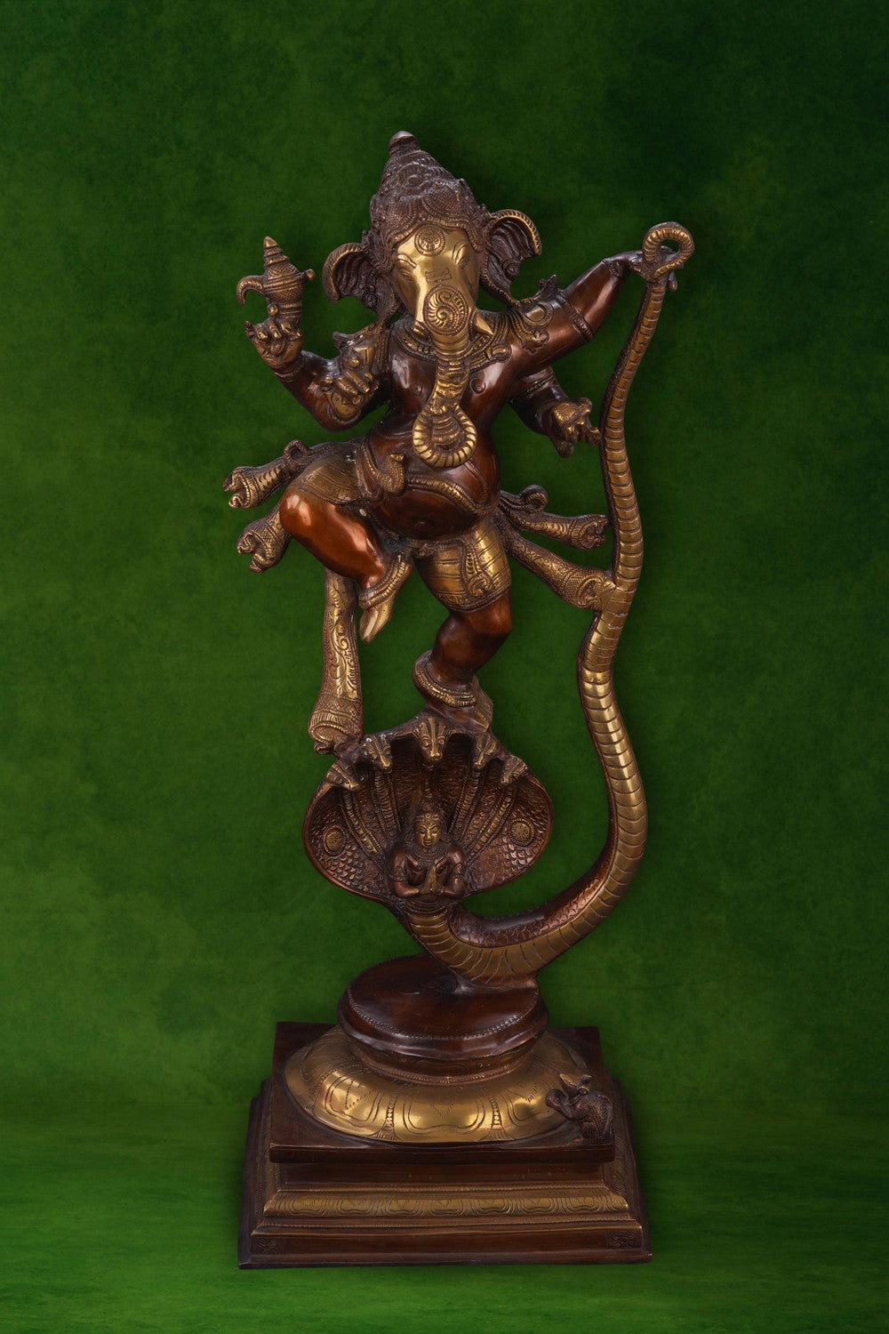 Image of Brass Ganesha idol dancing on a snake