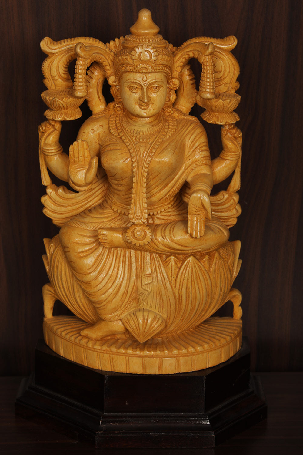 Collection of Shutters Wood Goddess Vishu Priya Lakshmi Idol in a gallery layout