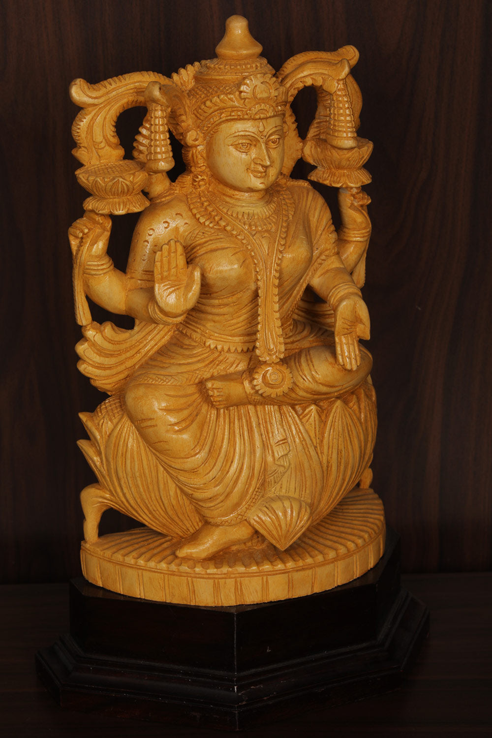 Collection of Shutters Wood Goddess Vishu Priya Lakshmi Idol in a gallery layout