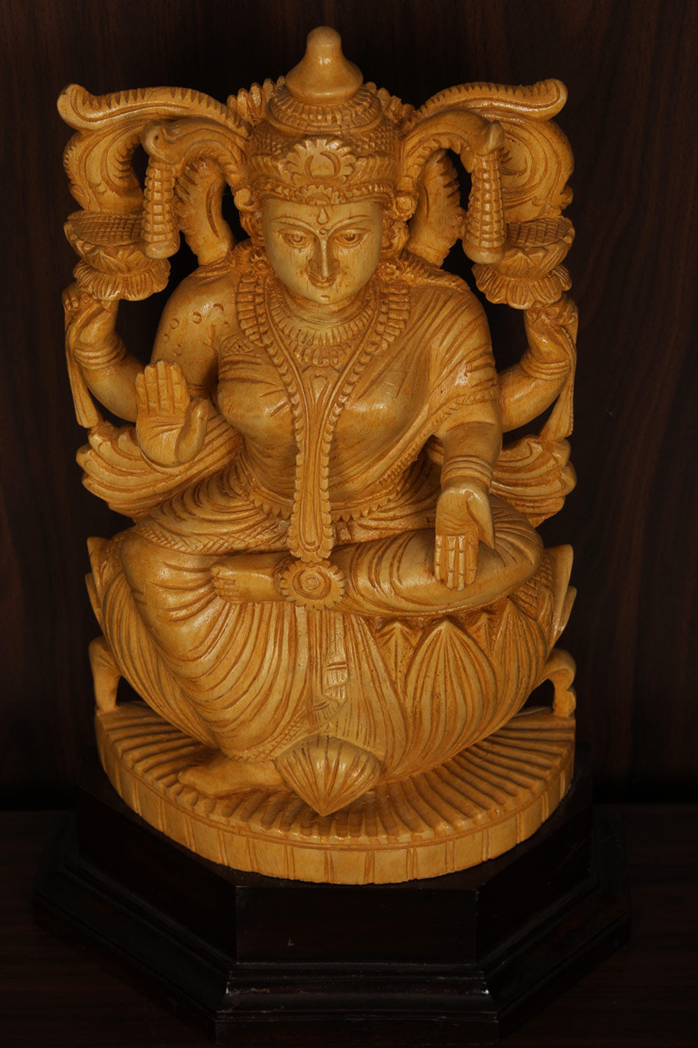 Collection of Shutters Wood Goddess Vishu Priya Lakshmi Idol in a gallery layout