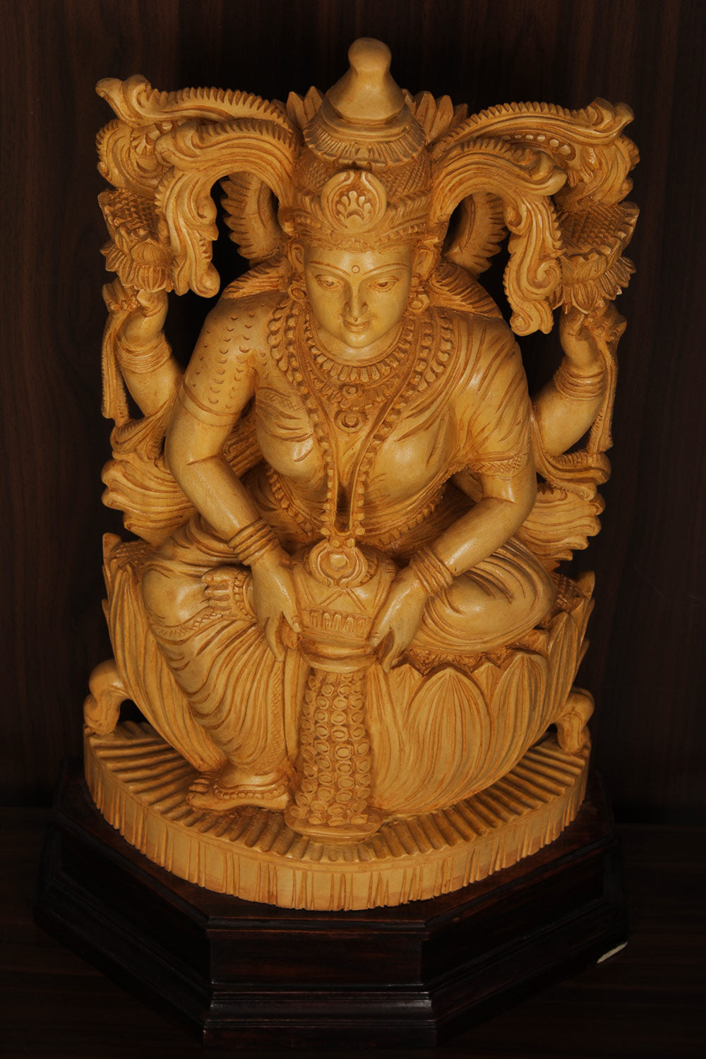 Collection of Shutters Wood Goddess Dhana Lakshmi Idol in a gallery layout