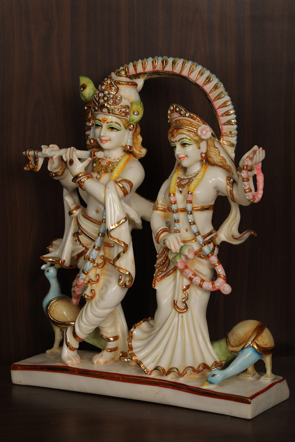 Collection of Cultured Marble Radha Krishna Statue in a gallery layout