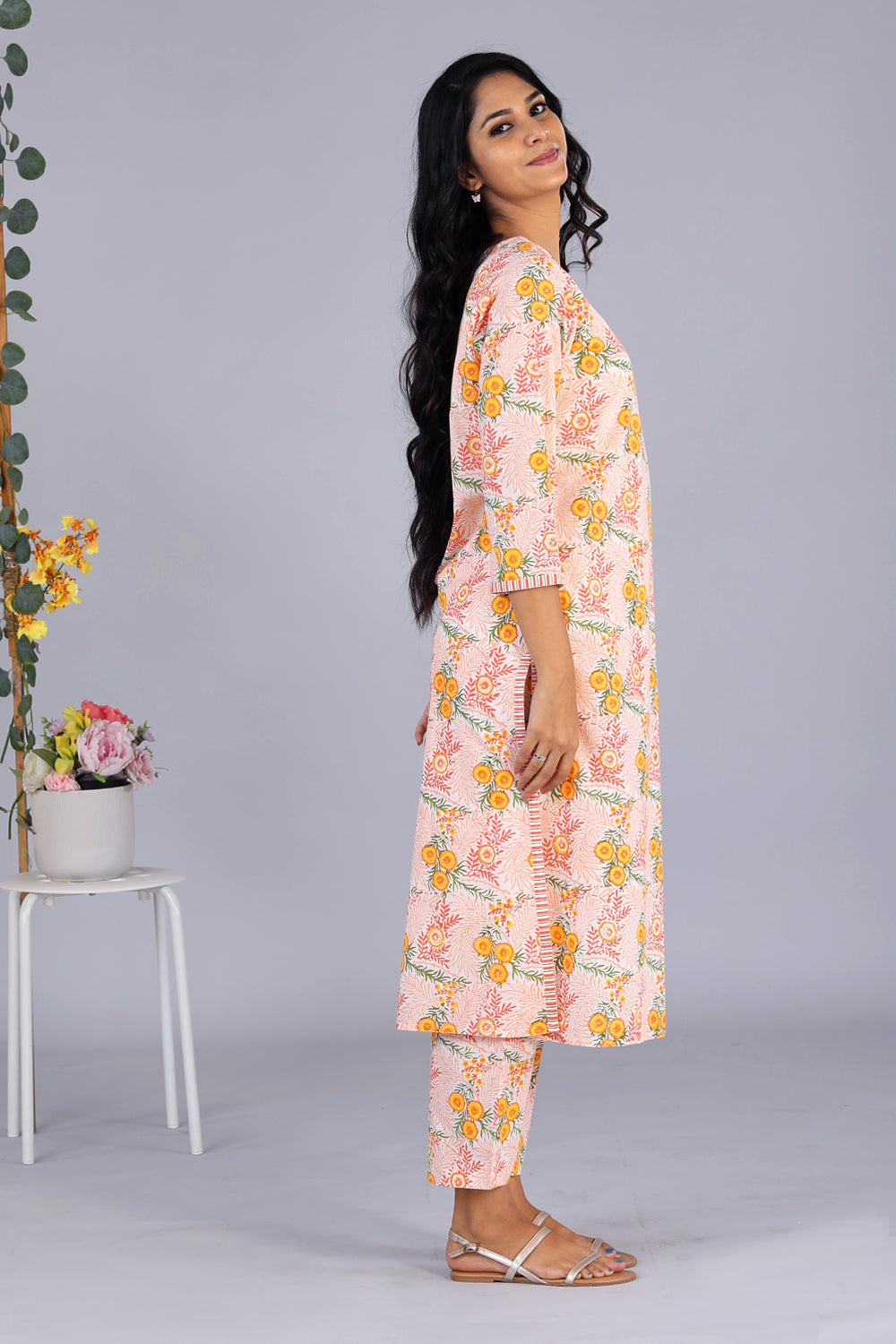 Collection of Hand block printed orange kurti and pants set in a gallery layout