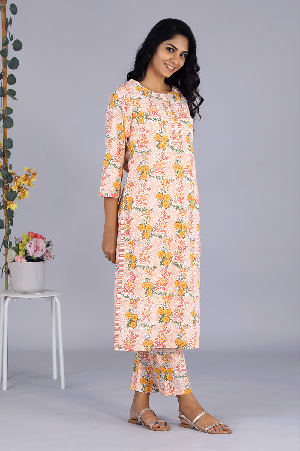 Collection of Hand block printed orange kurti and pants set in a gallery layout