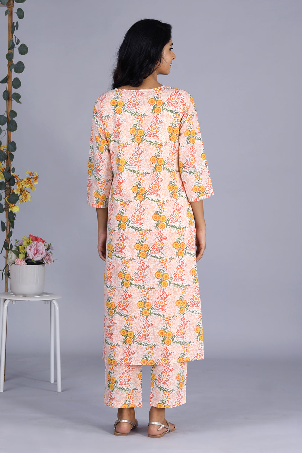 Collection of Hand block printed orange kurti and pants set in a gallery layout