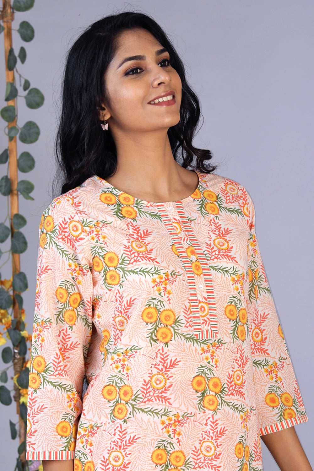 Collection of Hand block printed orange kurti and pants set in a gallery layout