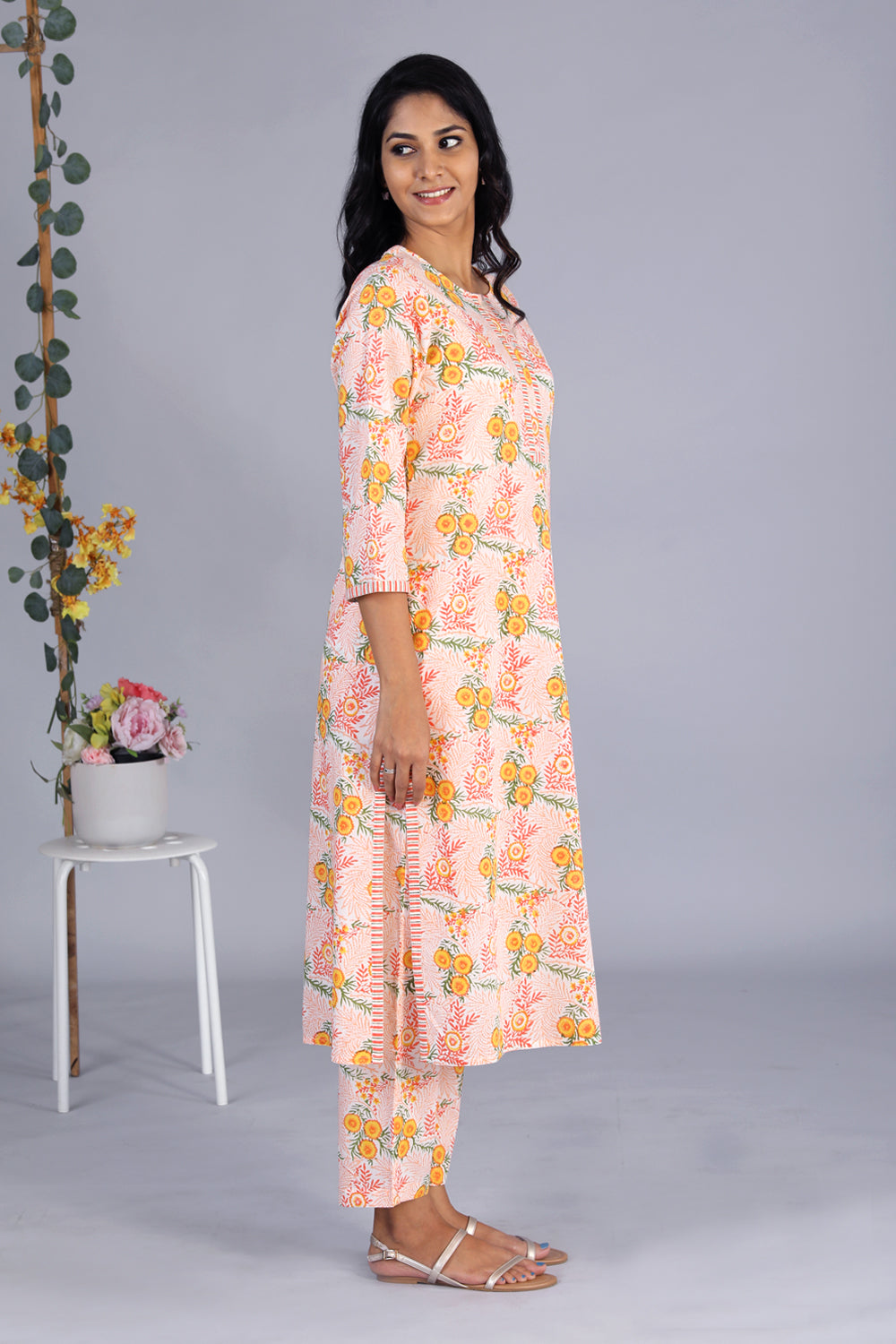 Collection of Hand block printed orange kurti and pants set in a gallery layout