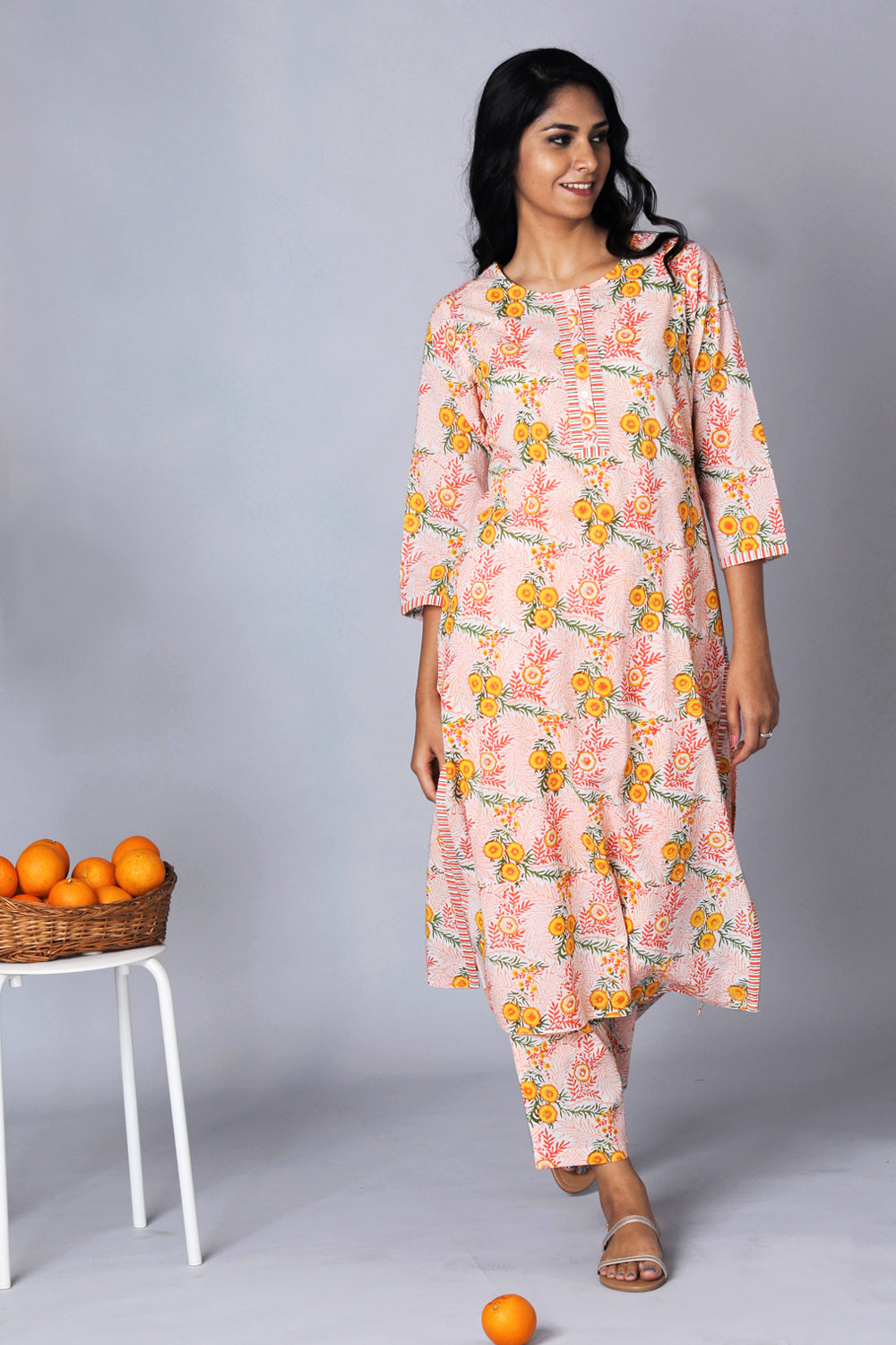 Collection of Hand block printed orange kurti and pants set in a gallery layout